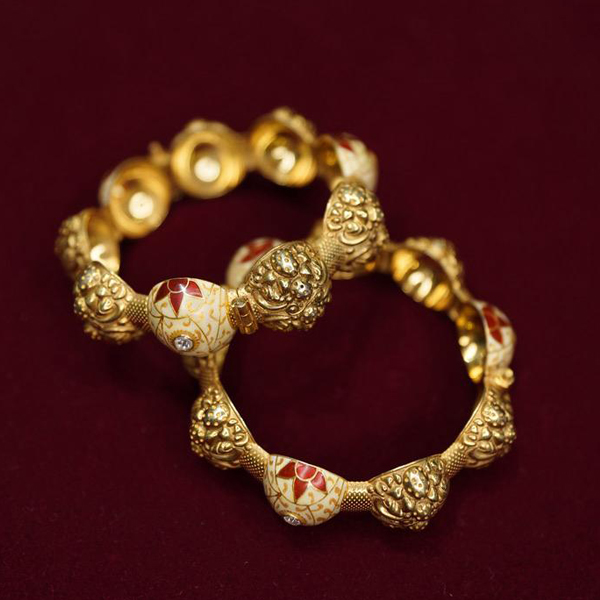 Enhance your traditional attire with hand-painted Meenakari enamel and Kundan gold-plated bangles