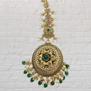 Antique Round Tikka with Emerald Drops is a timeless piece that is sure to turn heads