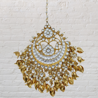 Traditional Pachi Kundan Tikka with Punjabi Tassels Peepal Pati for a Touch of Ethnic Glamour