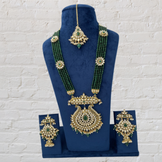 Feel like a Queen While Wearing this Green Kundan Embedded Long Set